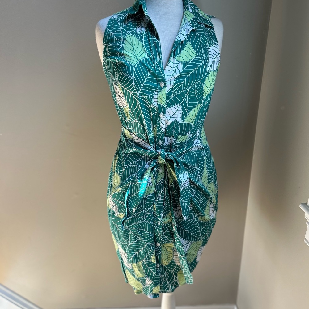 Untuckit tropical sleeveless shirt dress with wrap detail.